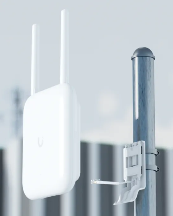 A UniFi outdoor access point with two antennas mounted on a metal pole